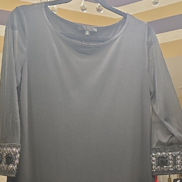 Tiana B. Elegant Black Dress with Embellished Cuffs - Picture 3 of 15